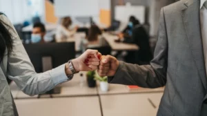 fist bump Leading with Empathy Creating a Compassionate Work Environment feat granger whitelaw