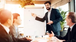 people in suits sitting at the table The Power of Networking How to Build Meaningful Connections in Your Industry feat